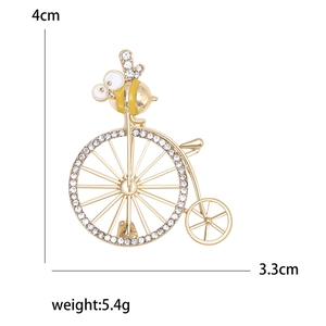 Enameled bee on vintage bicycle brooch with rhinestones in golden metal finish