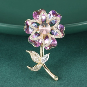 Exquisite crystal flower brooch with purple and pink heart petals in a gold finish setting
