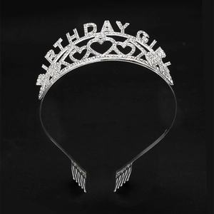 Close-up of Birthday Girl silver rhinestone tiara with heart patterns and hair combs