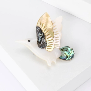 Elegant bird brooch crafted with natural mother-of-pearl and colorful shell inlay