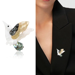 Elegant gold hummingbird brooch with natural mother of pearl and abalone shell inlay