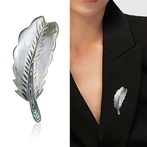 Elegant natural shell feather brooch with iridescent mother-of-pearl and silver leaf veins