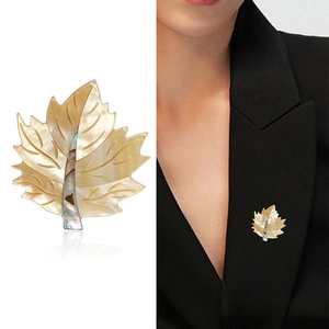 Elegant maple leaf brooch featuring natural mother of pearl with iridescent shell inlay