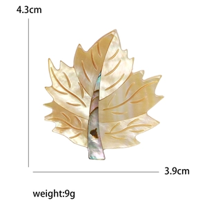 Exquisite shell maple leaf brooch in elegant gold finish with natural pearlescent texture