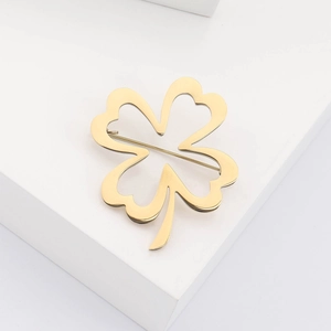 Minimalist gold stainless steel four-leaf clover brooch with hollow heart-shaped petals