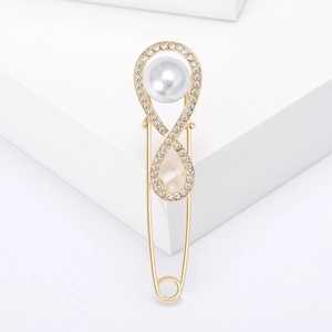 Golden infinity safety pin brooch with large pearl and sparkling rhinestones for clothing
