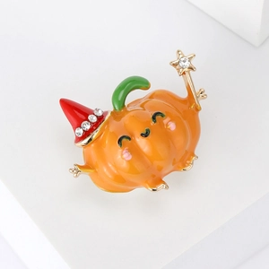 Cute Halloween pumpkin brooch with red wizard hat and sparkling crystals on white stand