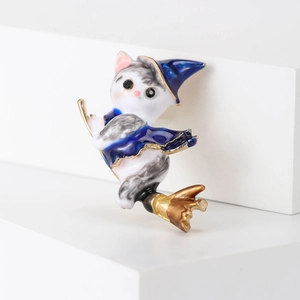 Creative enamel wizard cat brooch with blue cloak and golden broomstick detail