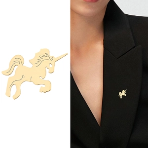 Polished gold stainless steel unicorn brooch pin shown on model and white background