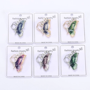 Detailed set of six colorful enamel butterfly brooches with sparkling crystal accents