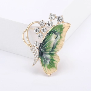 Elegant gold butterfly brooch with green gradient enamel and sparkling crystal rhinestones
