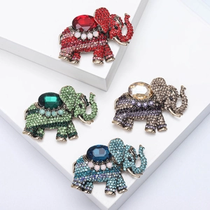 Vintage elephant brooches set with rhinestones in red green blue and champagne colors