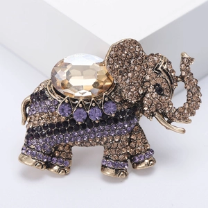 Vintage gold elephant brooch with champagne crystal and colorful rhinestones in 45-degree view