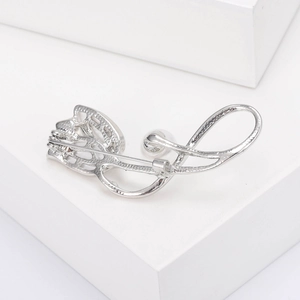 Detailed view of silver tulip brooch with pearl accent and secure metal pin fastening