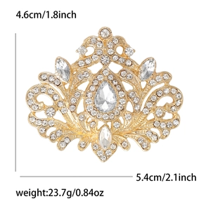 Broche vintage dorée avec strass scintillants et gemmes en forme de larme style baroque