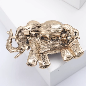 Detailed back view of vintage bronze elephant brooch with alloy texture and sturdy pin