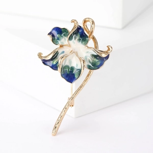 Elegant peach blossom flower brooch in gold metal with blue and white enamel petals