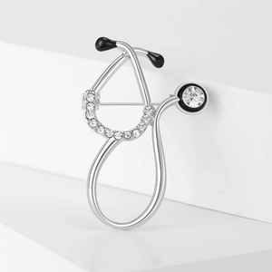 Elegant silver stethoscope brooch with sparkling rhinestones and black enamel detail