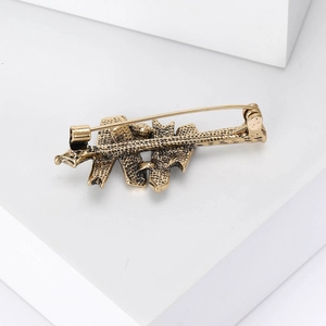 Broche vintage en alliage doré avec finition texturée et fermoir à épingle au dos