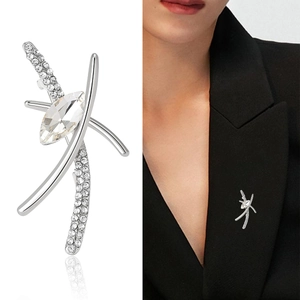Elegant geometric silver brooch with clear rhinestones on a professional black suit jacket