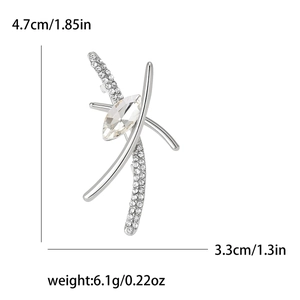 Elegant silver alloy brooch with clear rhinestones in an abstract cross design