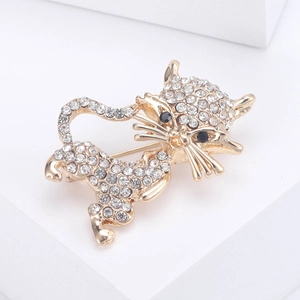 Elegant gold cat brooch with sparkling white rhinestones and black gem eyes