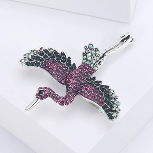 Detailed close-up of a flying crane brooch featuring colorful rhinestones and silver alloy