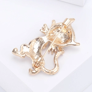 Cartoon cat metal brooch in gold finish showing the back pin mechanism and details