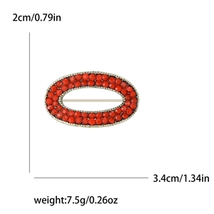 Oval red beaded brooch with gold metal frame measuring 3.4cm for clothing decor