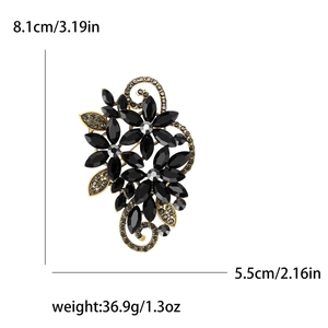 Elegant floral crystal brooch with black stones and gold hollow metal frame 8.1cm x 5.5cm