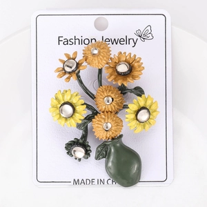 Detailed close-up of Van Gogh style sunflower brooch with vibrant yellow enamel petals
