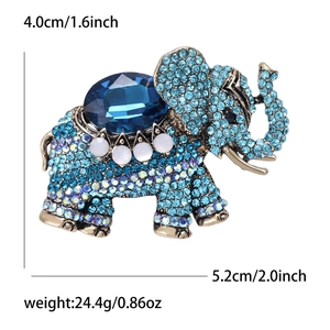 Vintage elephant brooch with blue rhinestones and antique gold alloy finish