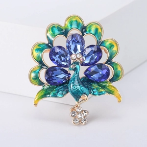 Luxurious peacock brooch with blue pear-shaped crystals and vibrant enamel finish
