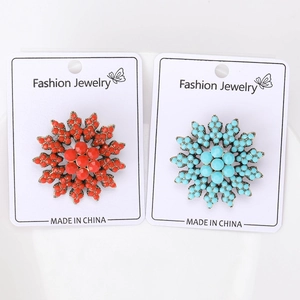 Baroque sunflower brooches in red and turquoise blue with vintage gold base and display card
