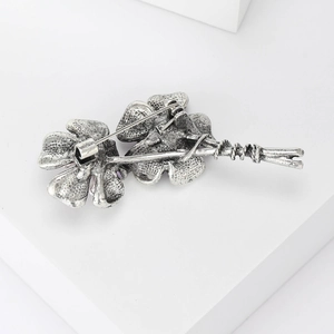 Detail view showing the sturdy silver alloy brooch back pin and secure closure mechanism