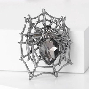 Gothic spider web brooch with dark drop-shaped crystal and black metal finish
