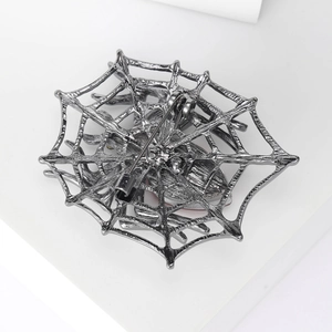 Creative spider web brooch with spider design in gunmetal alloy and back safety pin detail