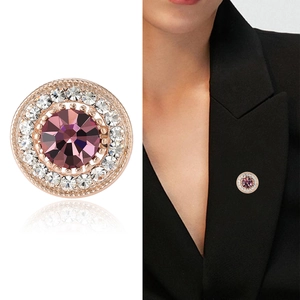 Elegant round brooch with purple crystal and zircon accents on black suit lapel