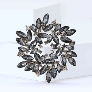 Hollow round crystal flower brooch with marquise cut stones and silver alloy base