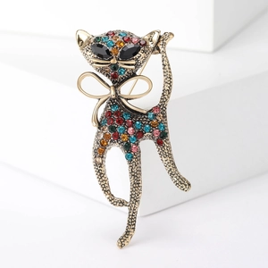 Vintage gold cat brooch with colorful rhinestones and elegant bowknot detail
