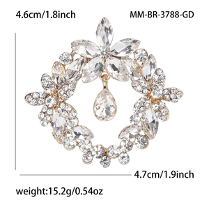 Elegant gold crystal flower wreath brooch with a sparkling teardrop pendant for suits