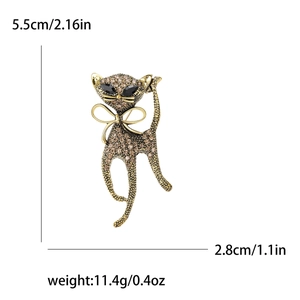 Sparkling gold cat brooch with brown rhinestones and bowknot detail for blazers