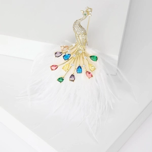 Vintage gold peacock brooch with sparkling rhinestones and colorful gemstone feathers
