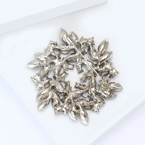 Detailed back view showing the safety pin clasp of the hollow round crystal brooch