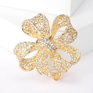 Élégante broche fleur dorée avec cristaux blancs et pierres précieuses irisées luxe
