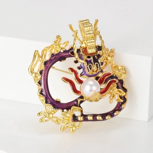 Exquisite gold-plated Chinese dragon brooch with purple enamel and a central white pearl