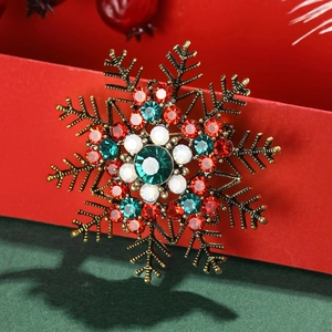 Snowflake brooch with green and red crystals on vintage gold alloy for Christmas