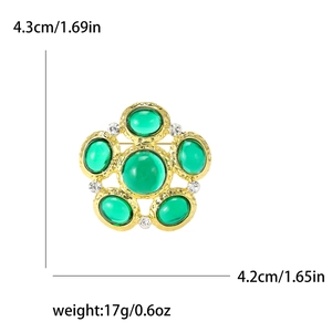 Vintage gold brooch with green gemstones and white rhinestones, size 4.3cm by 4.2cm