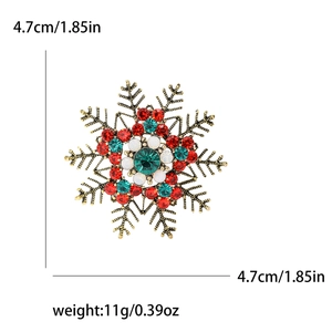 Snowflake rhinestone brooch in gold finish with red, green and white crystal stones