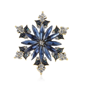 Exquisite gold snowflake brooch with dark blue marquise gems and white rhinestones